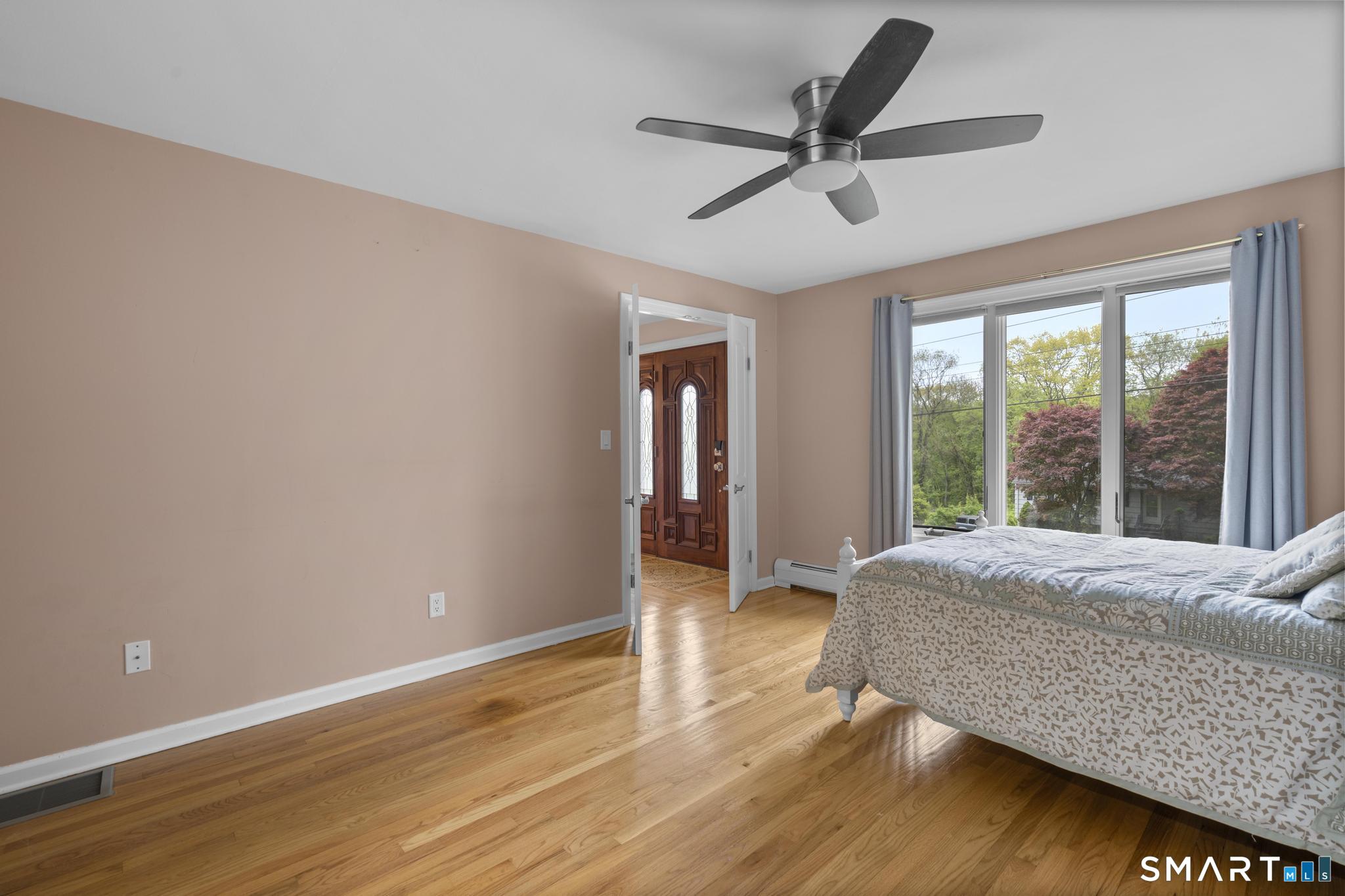 832 Quarter Mile Road Orange, CT 06477 - Photo 9 of 39 a living room with wooden floor and window
