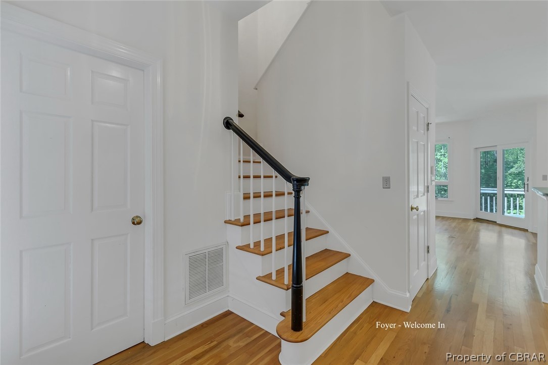 5818 Rivers Landing Terrace, Unit 5818 White Stone, VA 22578 - Photo 9 of 50 Stairway featuring light hardwood / wood-style flooring