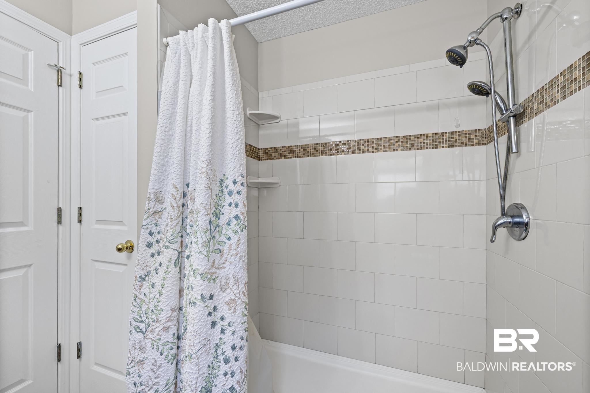 2881 Eslava Circle Lillian, AL 36549 - Photo 17 of 58 Full bathroom with a textured ceiling and shower / tub combo