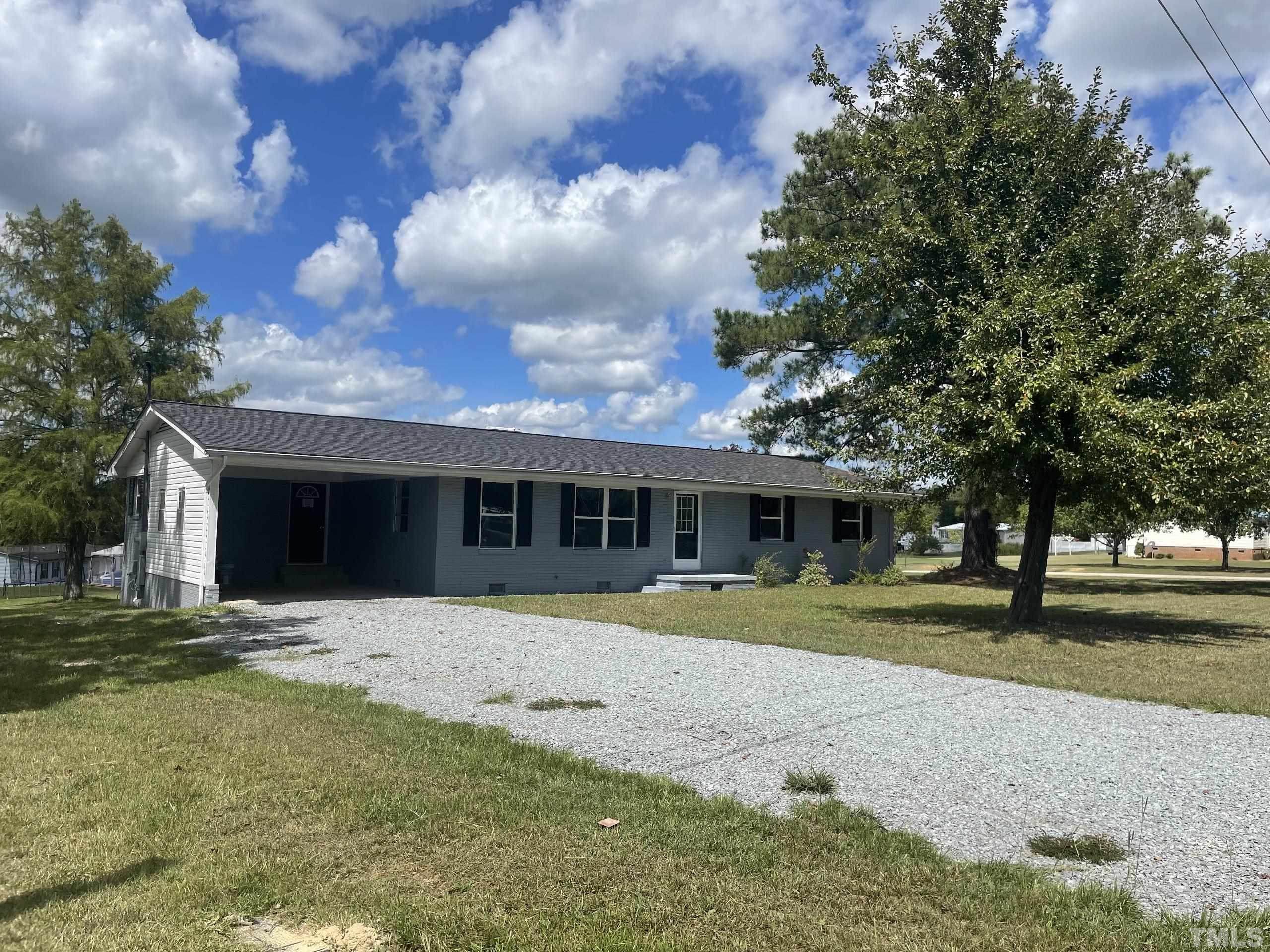 231 Whittington Road Angier, NC 27501 - Photo 3 of 28 a front view of a house with a yard