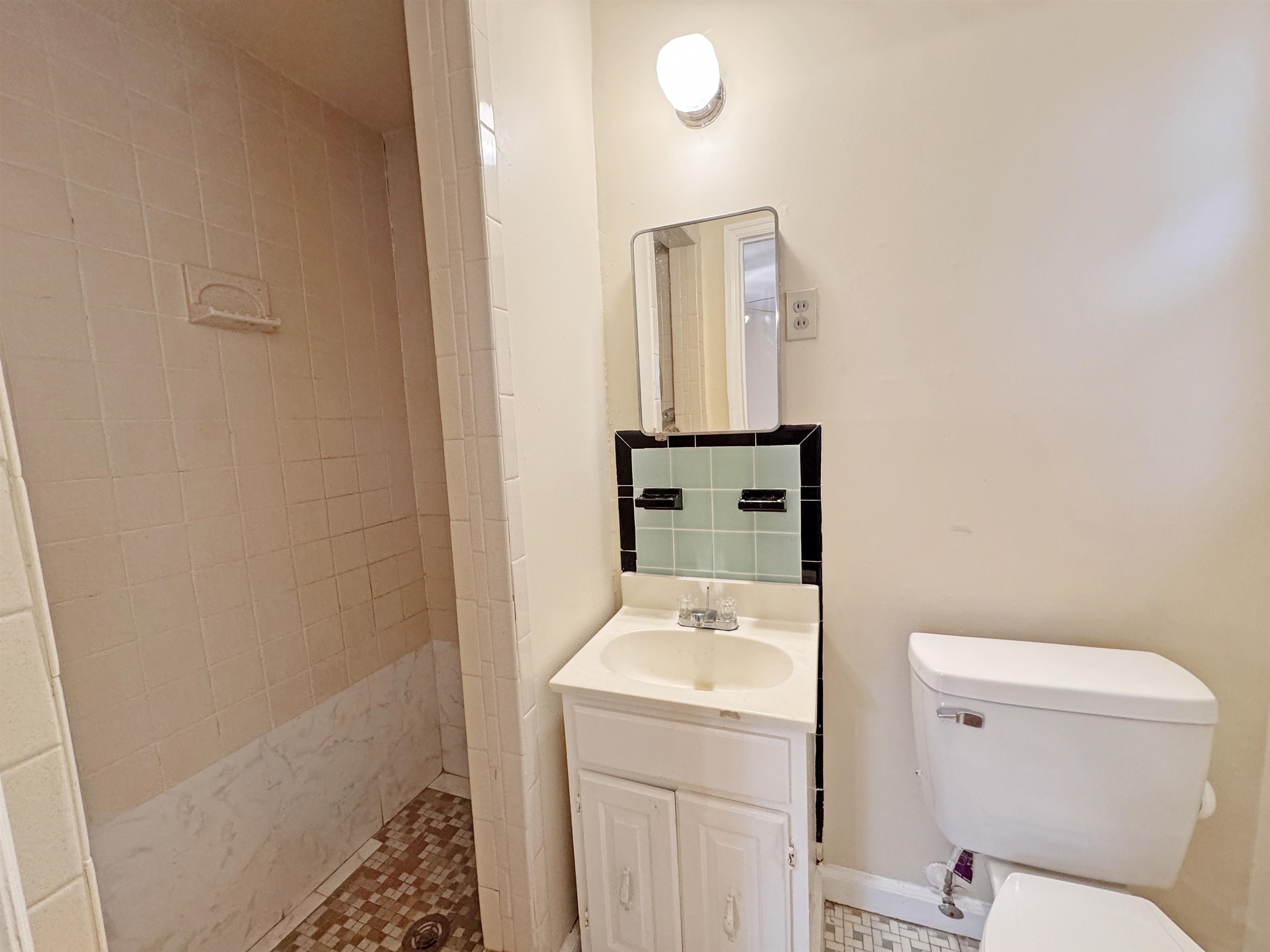 1519 South White Station Road Memphis, TN 38117 - Photo 13 of 31 a bathroom with a toilet sink and mirror