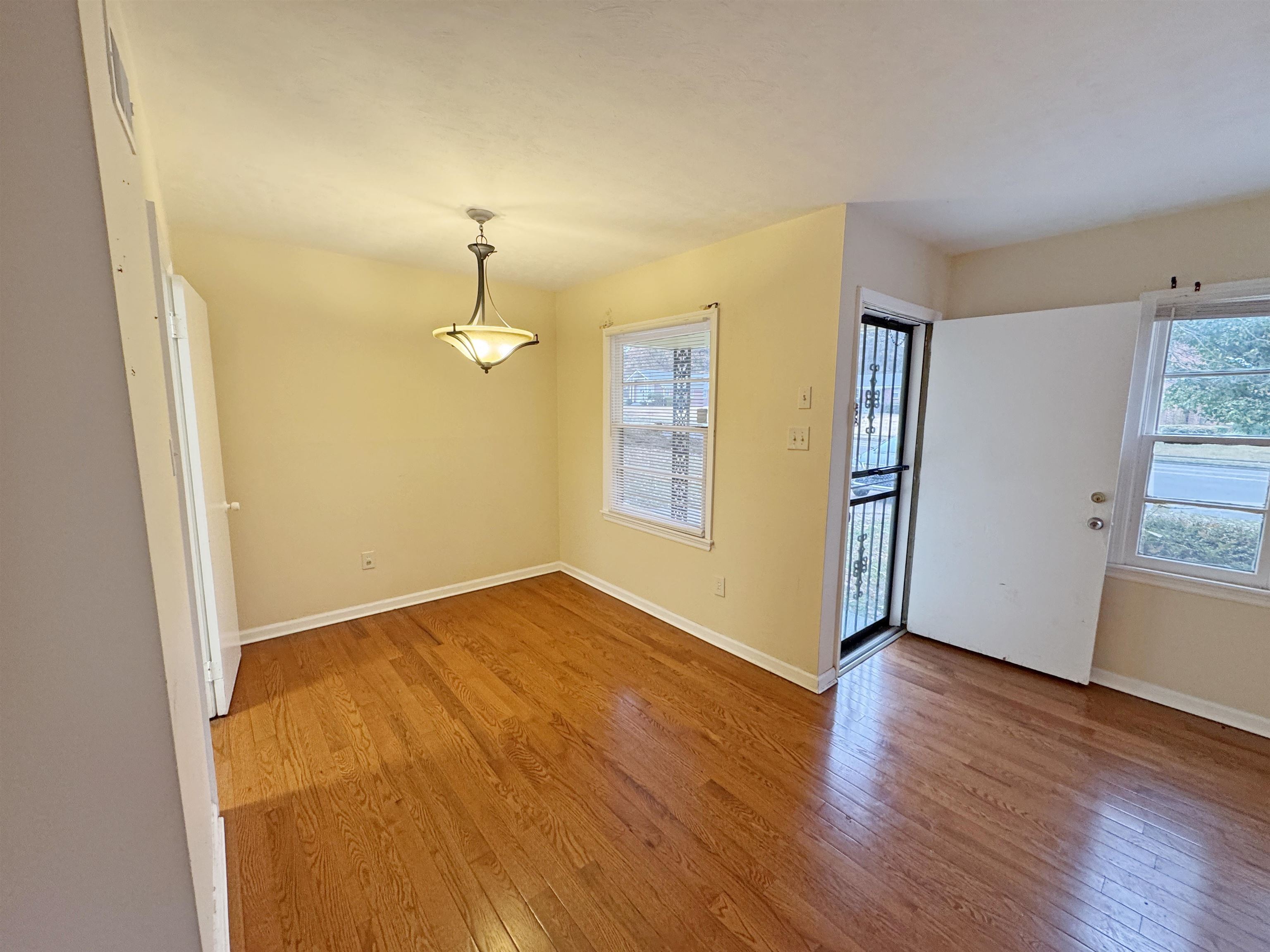 1519 South White Station Road Memphis, TN 38117 - Photo 18 of 31 a view of empty room with wooden floor and fan