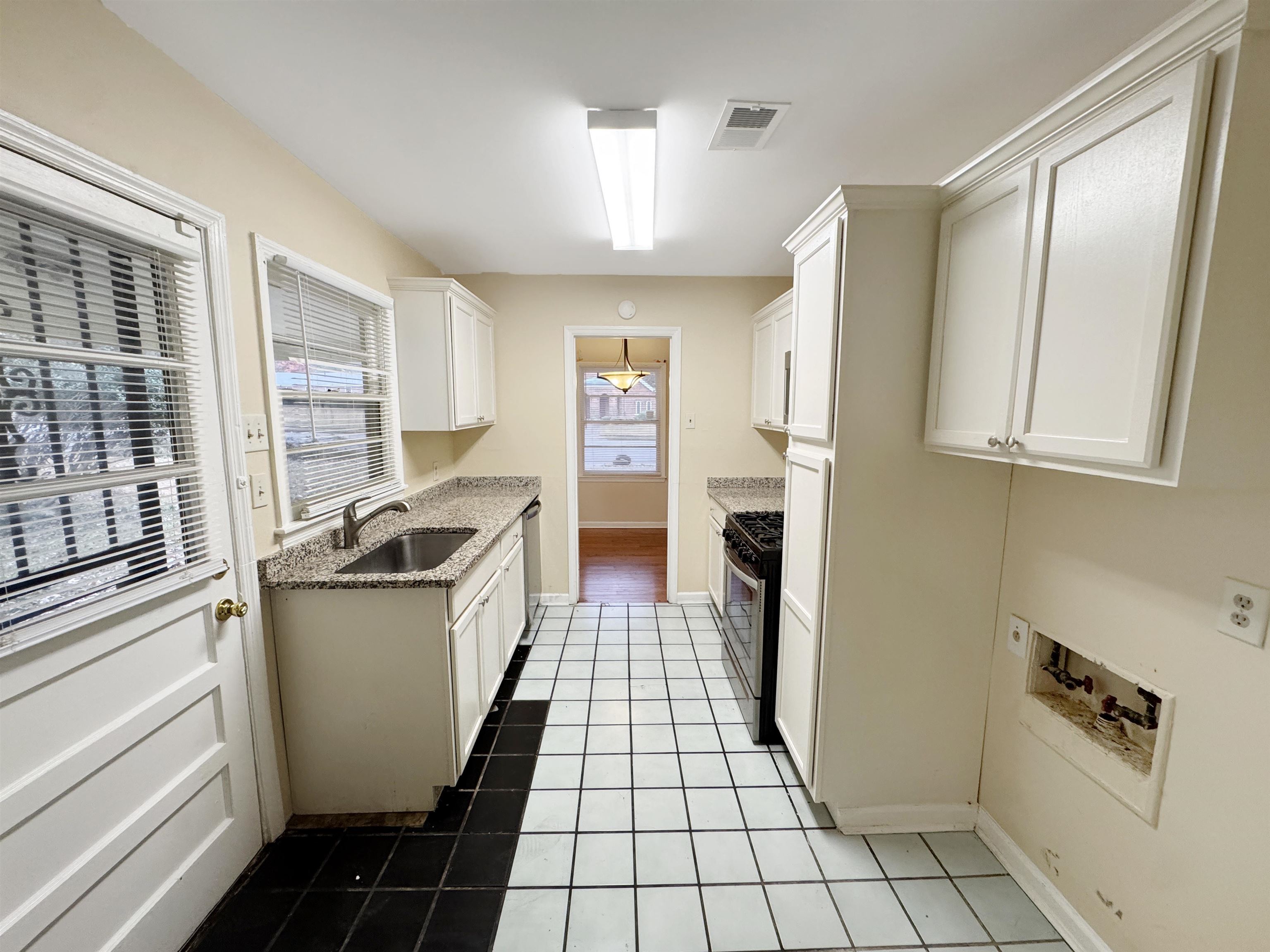1519 South White Station Road Memphis, TN 38117 - Photo 24 of 31 a kitchen with stainless steel appliances a refrigerator and a stove
