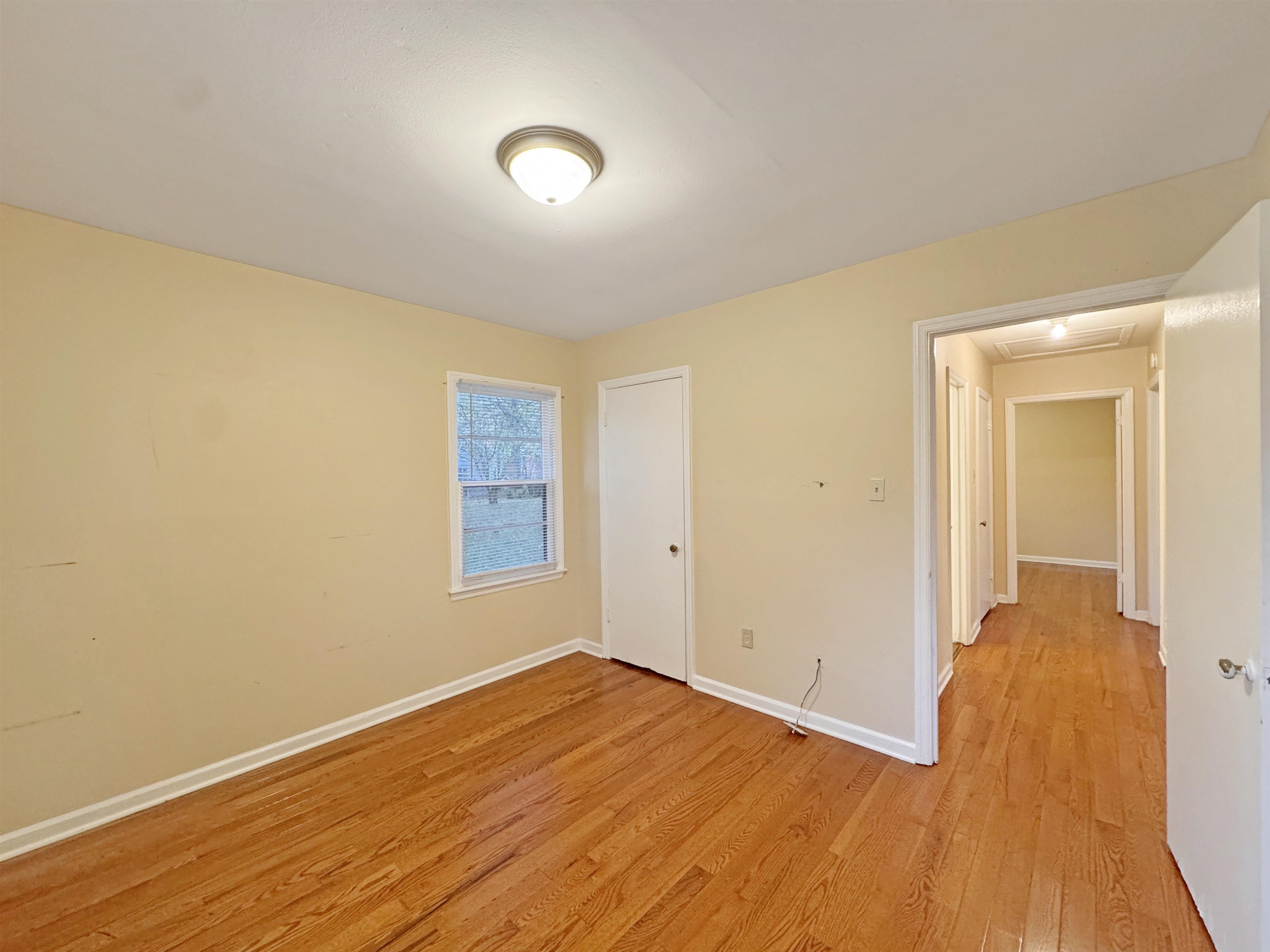 1519 South White Station Road Memphis, TN 38117 - Photo 30 of 31 an empty room with wooden floor and windows
