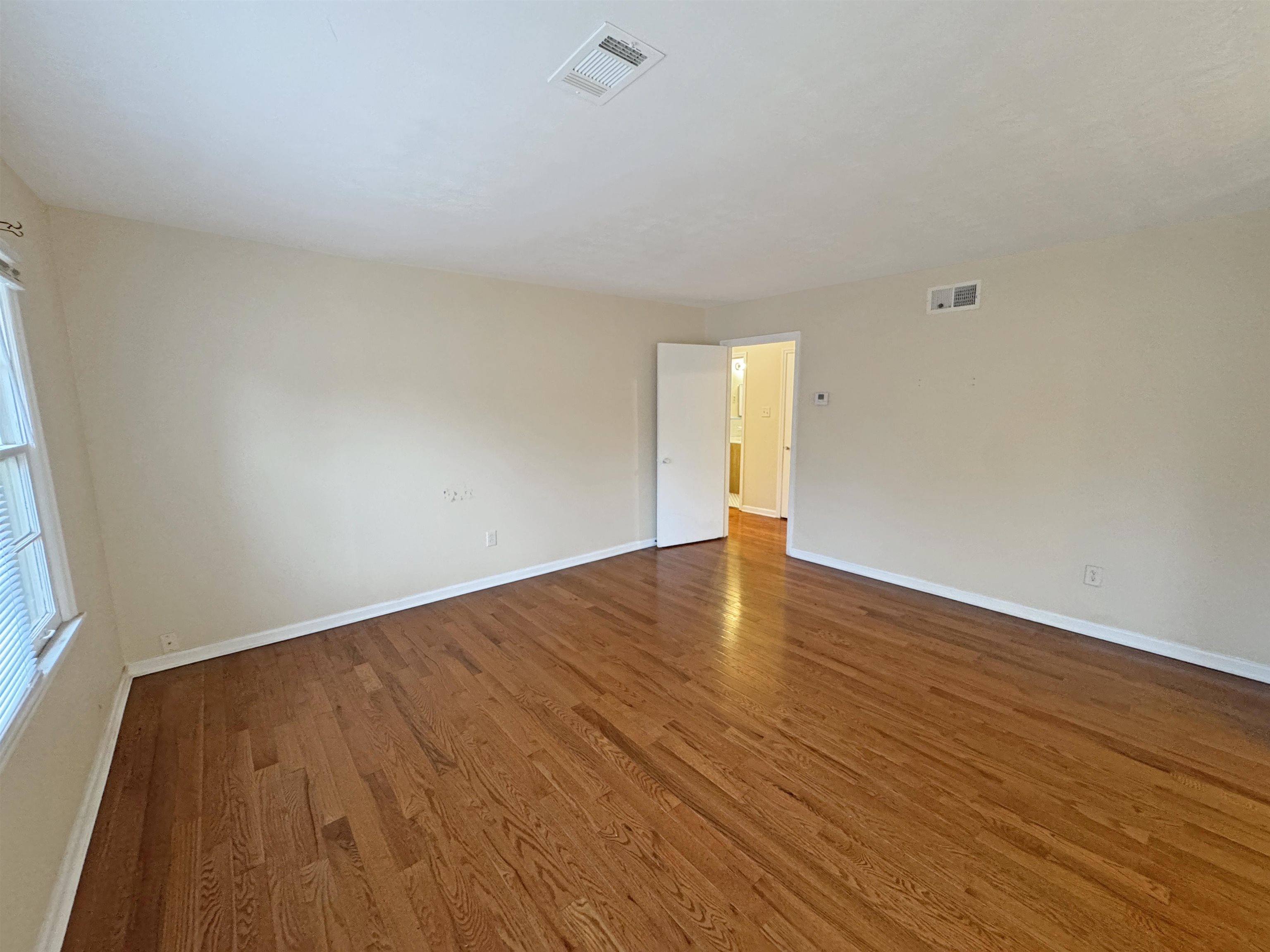 1519 South White Station Road Memphis, TN 38117 - Photo 3 of 31 a view of an empty room and wooden floor