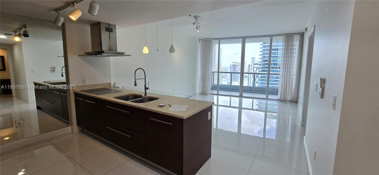 485 Brickell Avenue, Unit 4103 Miami, FL 33131 - Photo 7 of 13 a kitchen with stainless steel appliances granite countertop a stove a sink and a refrigerator