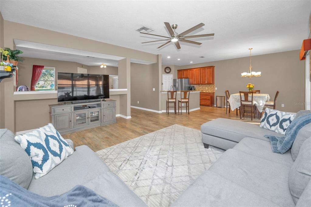 3619 Hatchbend Way Wesley Chapel, FL 33544 - Photo 13 of 86 a living room with furniture and a flat screen tv