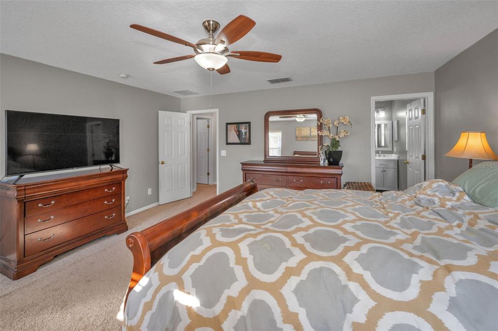 3619 Hatchbend Way Wesley Chapel, FL 33544 - Photo 29 of 86 a bedroom with a bed and a flat screen tv