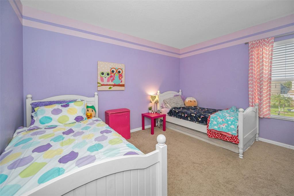 3619 Hatchbend Way Wesley Chapel, FL 33544 - Photo 34 of 86 a bedroom with a bed and a dresser