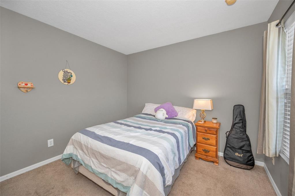 3619 Hatchbend Way Wesley Chapel, FL 33544 - Photo 37 of 86 a bedroom with a bed and a window