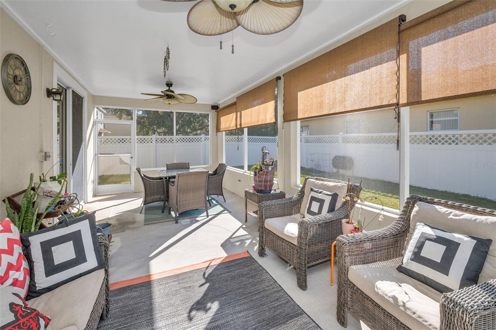 3619 Hatchbend Way Wesley Chapel, FL 33544 - Photo 42 of 86 a living room with furniture and a floor to ceiling window