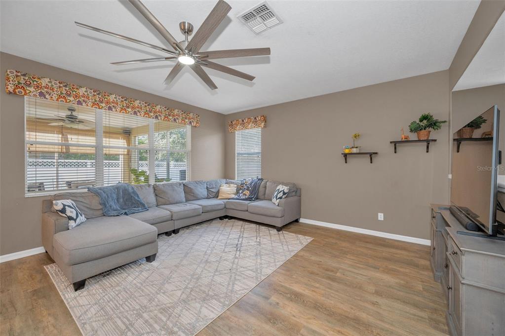 3619 Hatchbend Way Wesley Chapel, FL 33544 - Photo 10 of 86 a living room with furniture and a large window