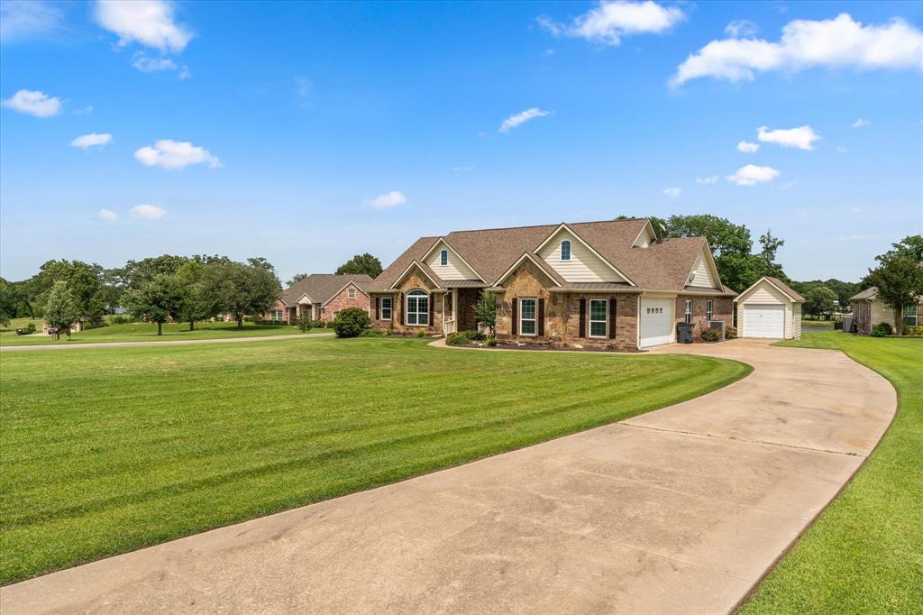 345 Rains County Road 3390 Emory, TX 75440 - Photo 4 of 39 a view of a big house with a big yard and potted plants