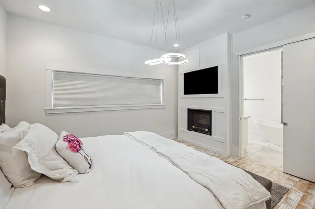 a bathroom with a granite countertop sink mirror vanity and bathtub