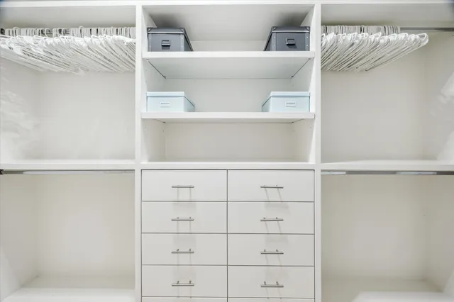 a bedroom with a bed and a mirror