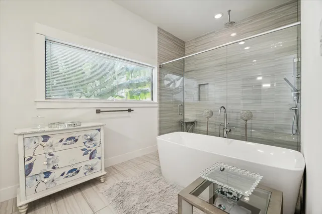 a bathroom with a shower and a sink