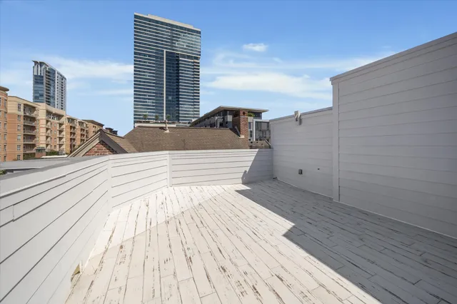 a room with lots of furniture and a potted plant