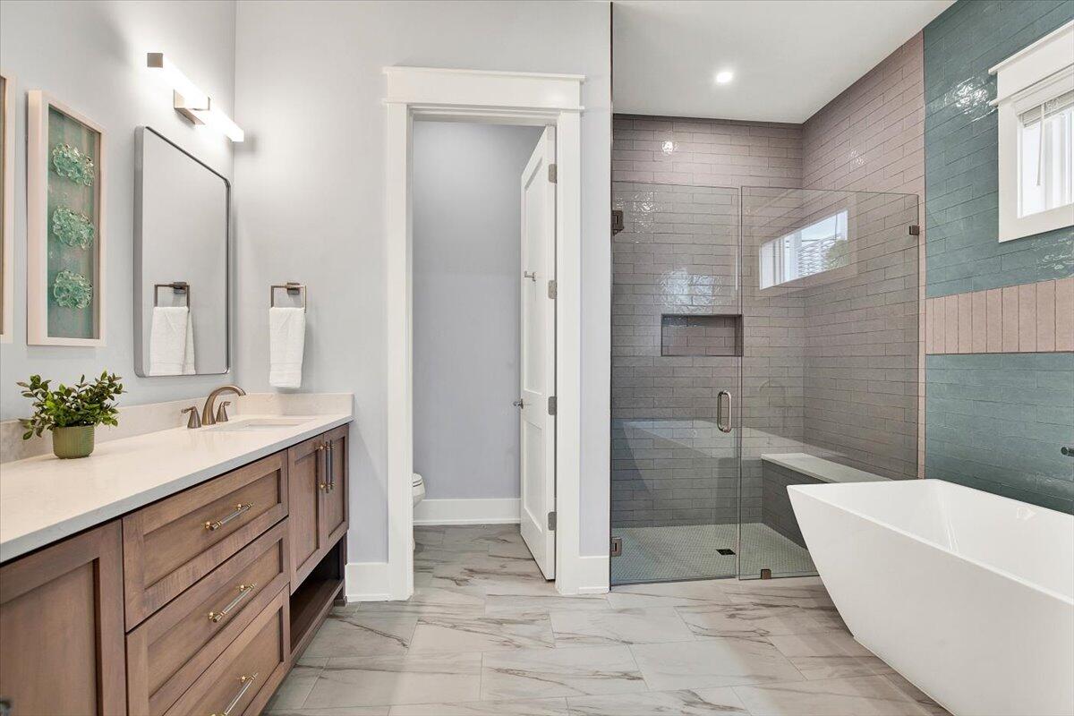 16418 Front Beach Road Panama City Beach, FL 32413 - Photo 13 of 40 a bathroom with a granite countertop sink mirror and shower