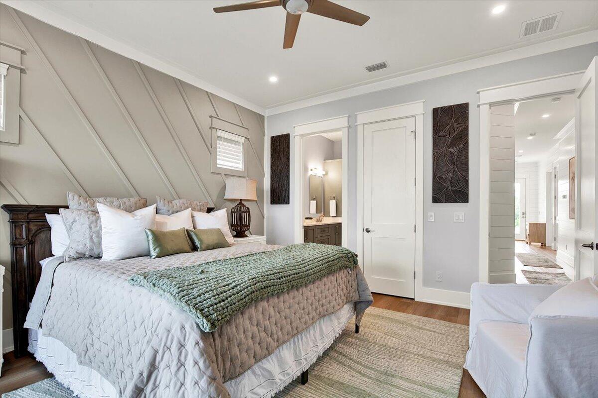 16418 Front Beach Road Panama City Beach, FL 32413 - Photo 16 of 40 a spacious bedroom with a bed and a chandelier