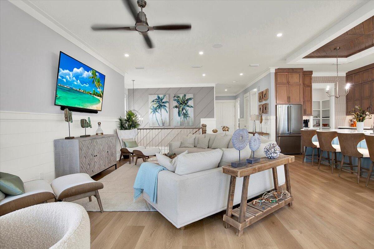 16418 Front Beach Road Panama City Beach, FL 32413 - Photo 26 of 40 a living room with furniture and a flat screen tv