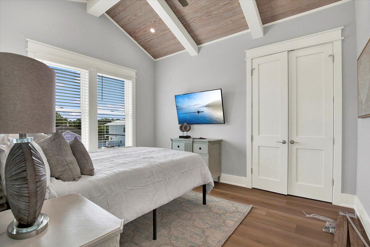 16418 Front Beach Road Panama City Beach, FL 32413 - Photo 31 of 40 a bedroom with a bed and a flat screen tv