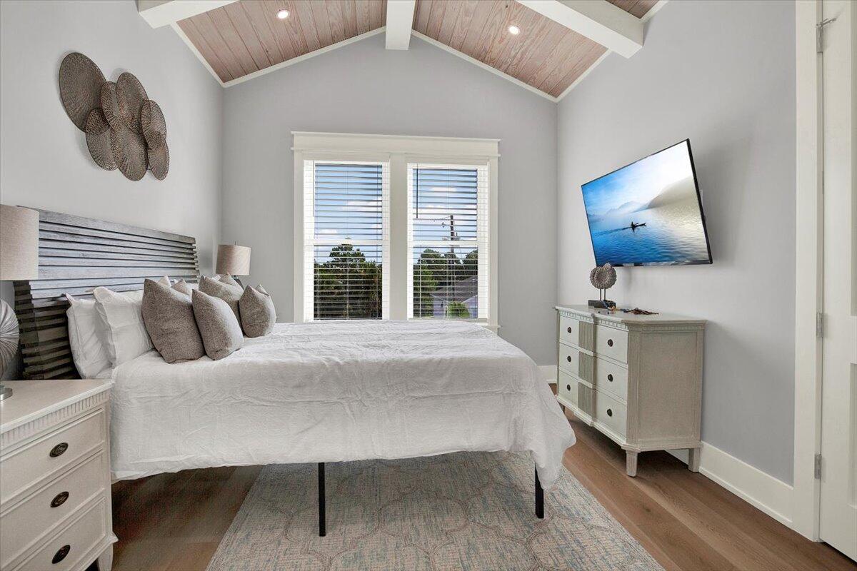 16418 Front Beach Road Panama City Beach, FL 32413 - Photo 32 of 40 a bedroom with furniture and a window