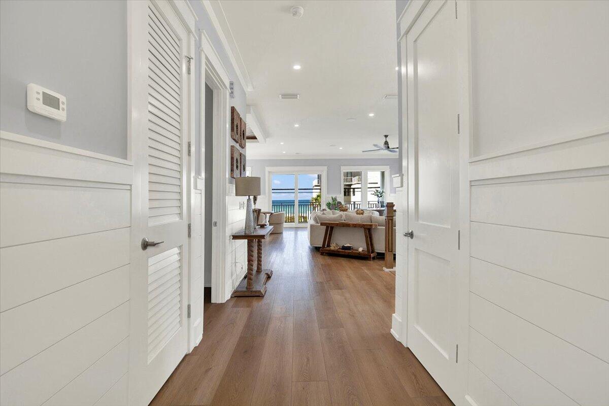 16418 Front Beach Road Panama City Beach, FL 32413 - Photo 35 of 40 a living room with furniture and a wooden floor