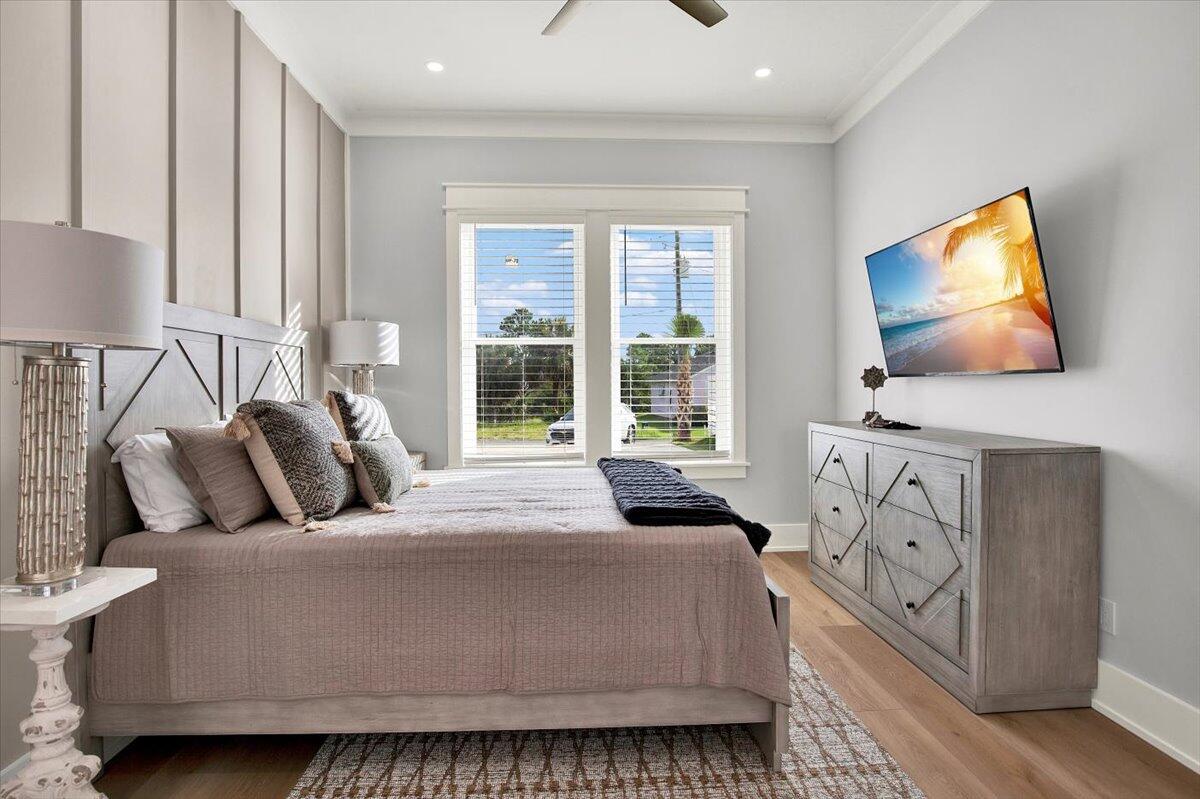 16418 Front Beach Road Panama City Beach, FL 32413 - Photo 6 of 40 a bedroom with bed and flat screen tv