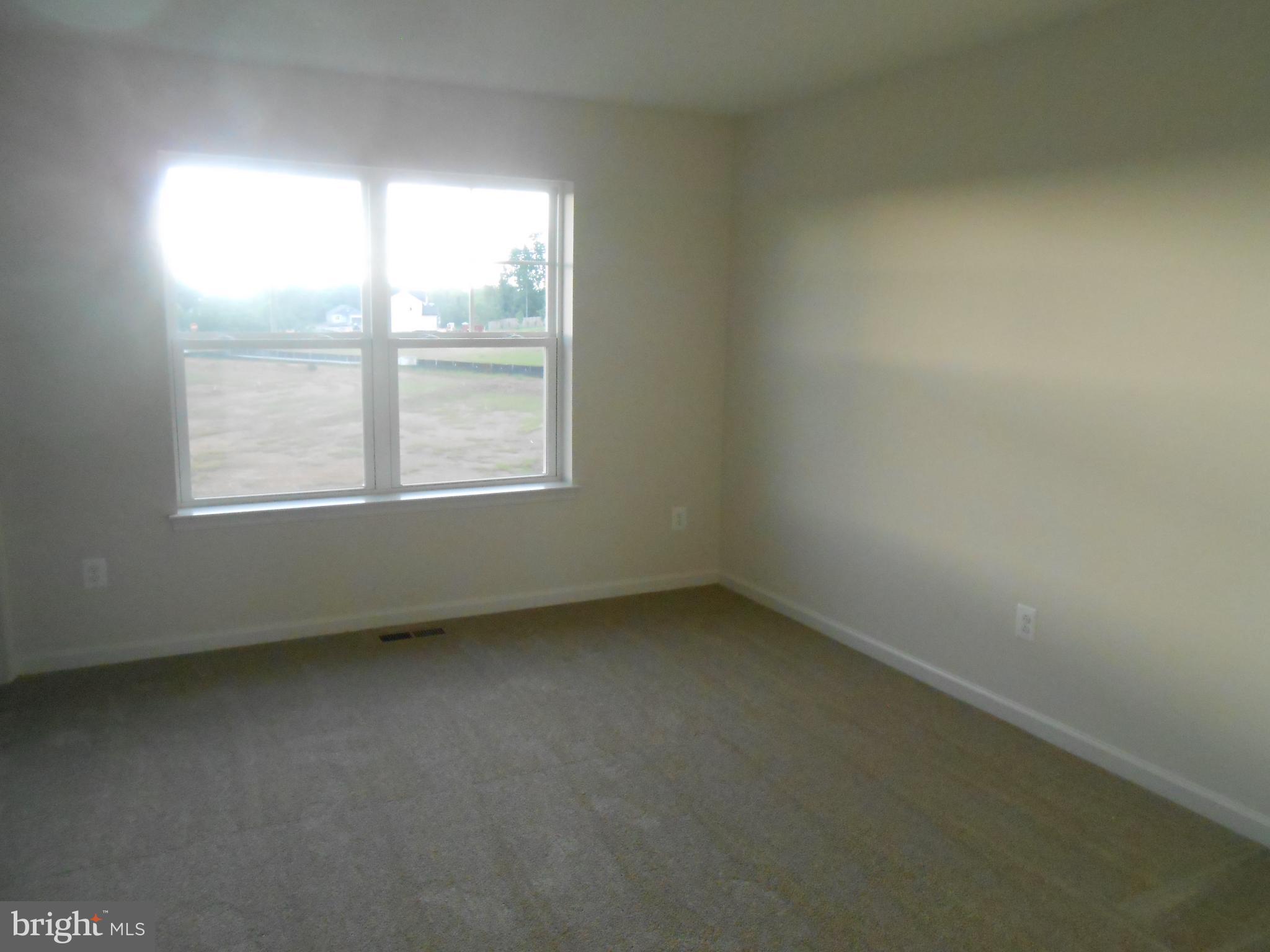 107 Fading Star Court Stephenson, VA 22656 - Photo 11 of 50 an empty room with a window