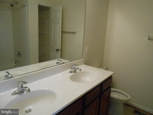 a bathroom with a sink and a vanity