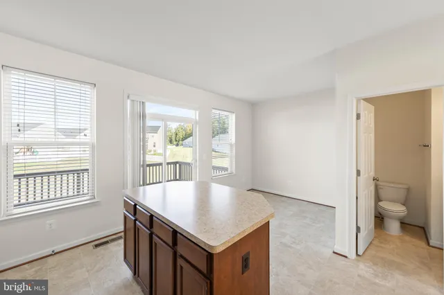 a bathroom with a toilet a sink and a mirror