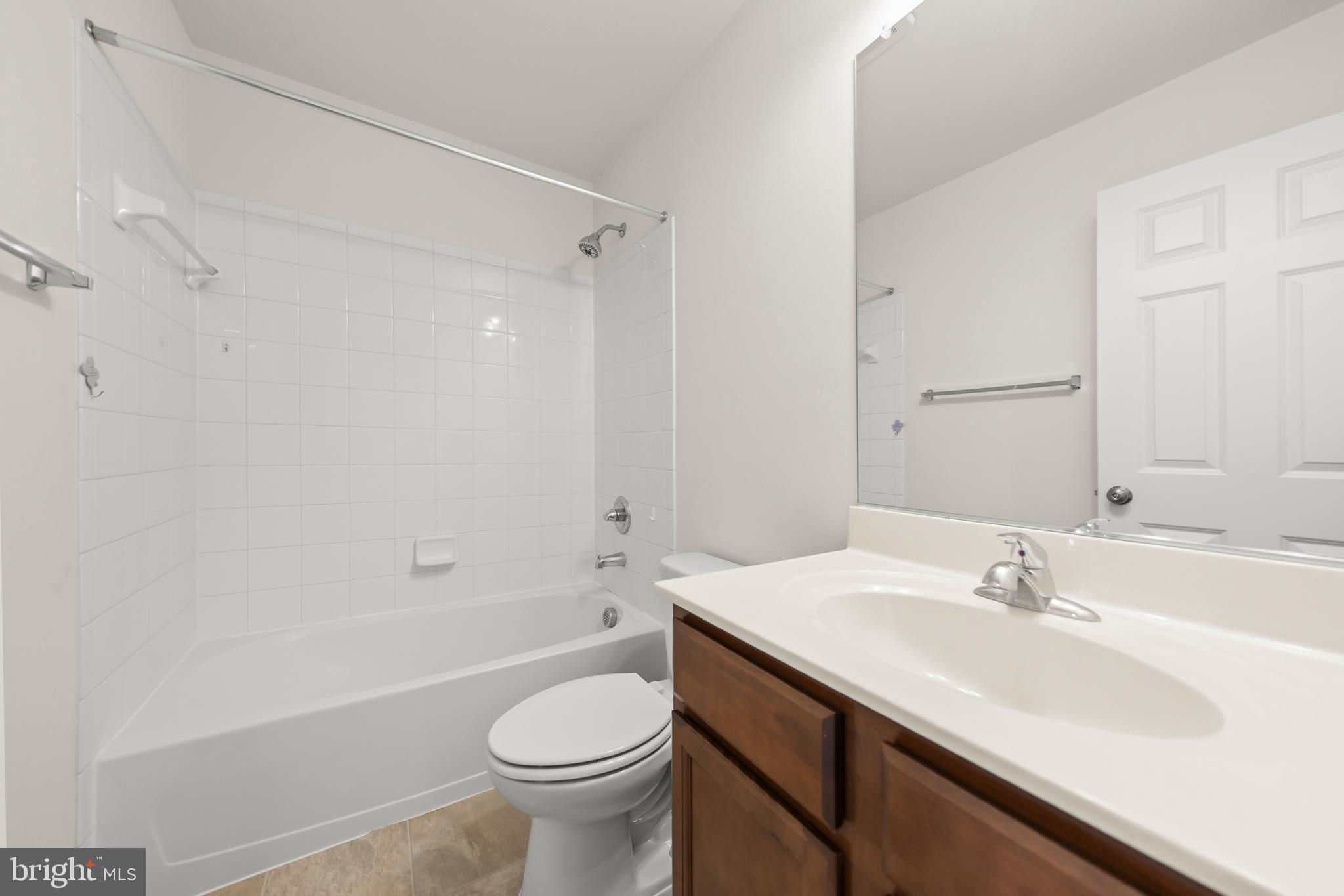 107 Fading Star Court Stephenson, VA 22656 - Photo 36 of 50 a bathroom with a sink a toilet and a bathtub