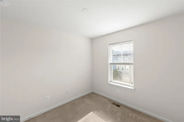 a view of a balcony with wooden floor