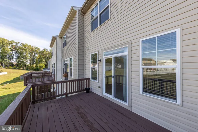 a view of a brick building next to a yard