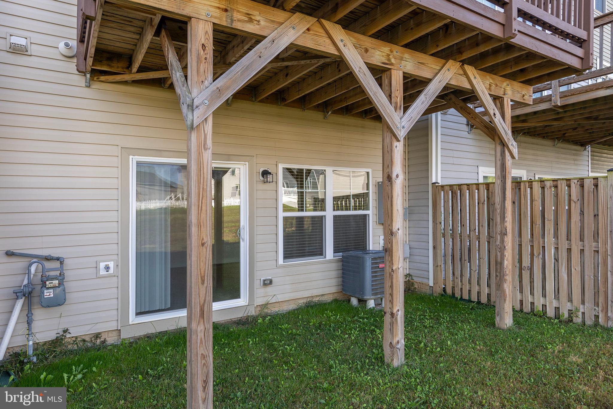 107 Fading Star Court Stephenson, VA 22656 - Photo 49 of 50 a backyard of a house with wooden floor and fence