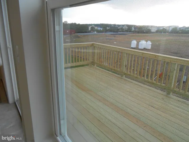 a view of a balcony with wooden floor