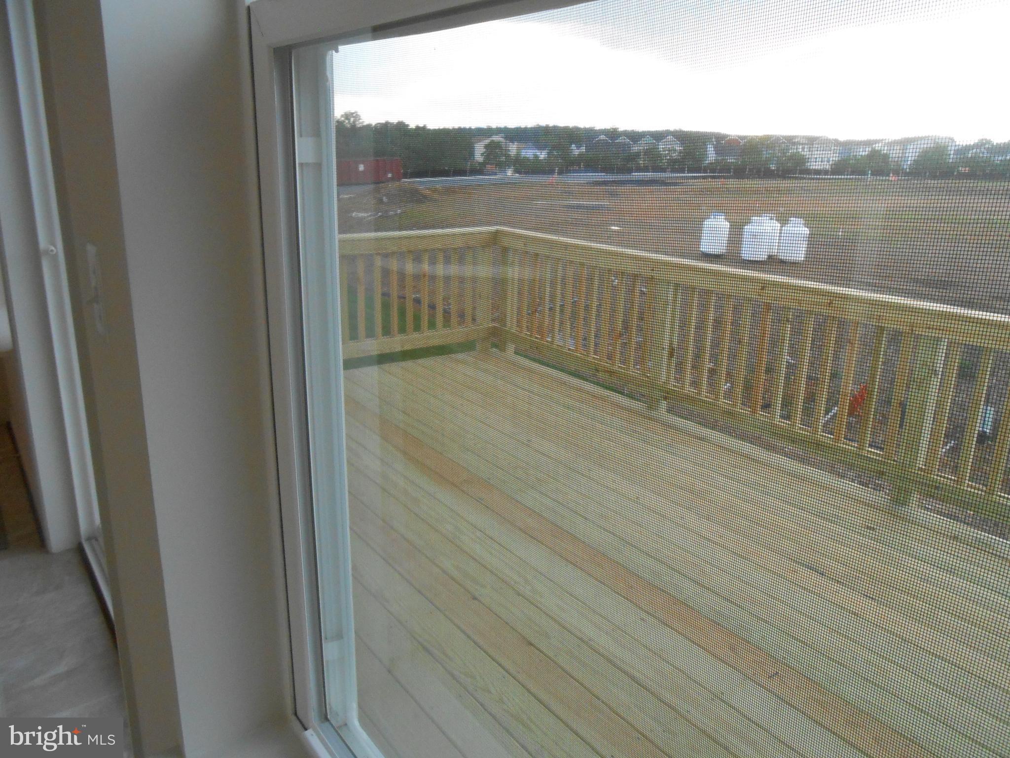107 Fading Star Court Stephenson, VA 22656 - Photo 5 of 50 a view of a balcony with wooden floor