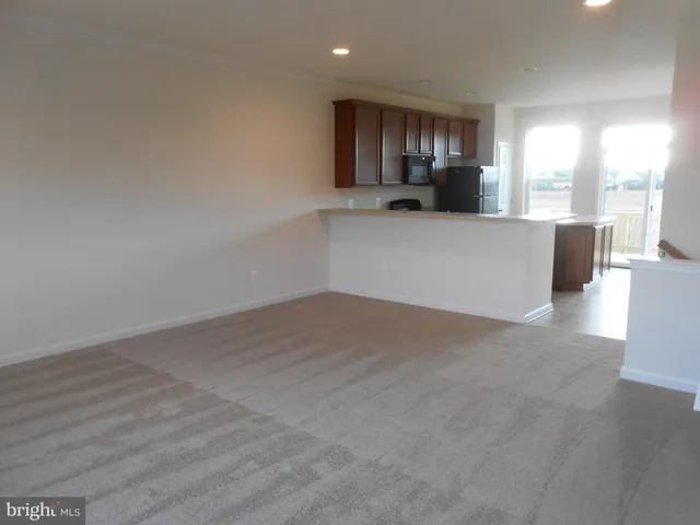 a view of a kitchen with a sink and a window