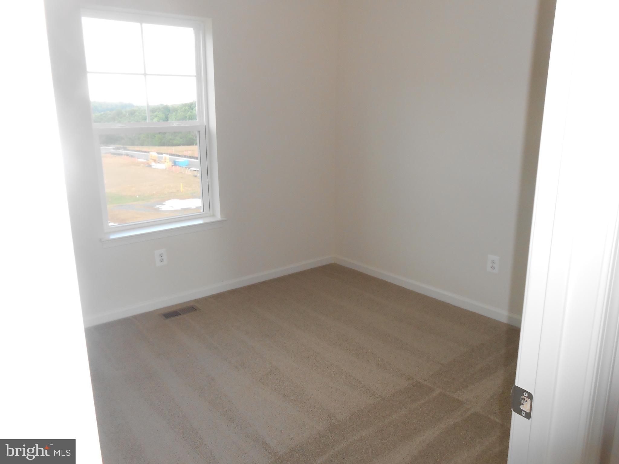 107 Fading Star Court Stephenson, VA 22656 - Photo 9 of 50 a view of empty room with window