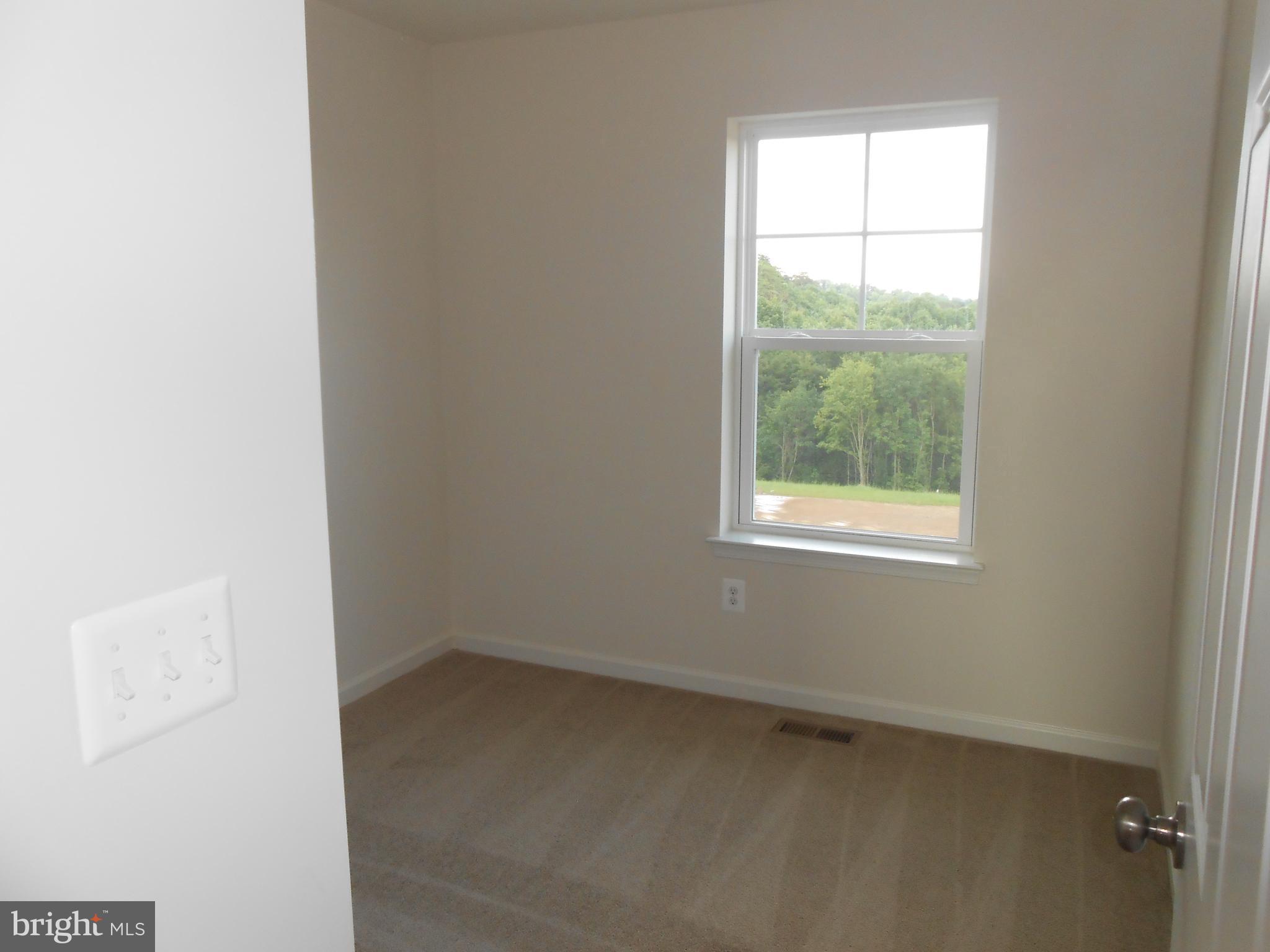 107 Fading Star Court Stephenson, VA 22656 - Photo 10 of 50 an empty room with a window