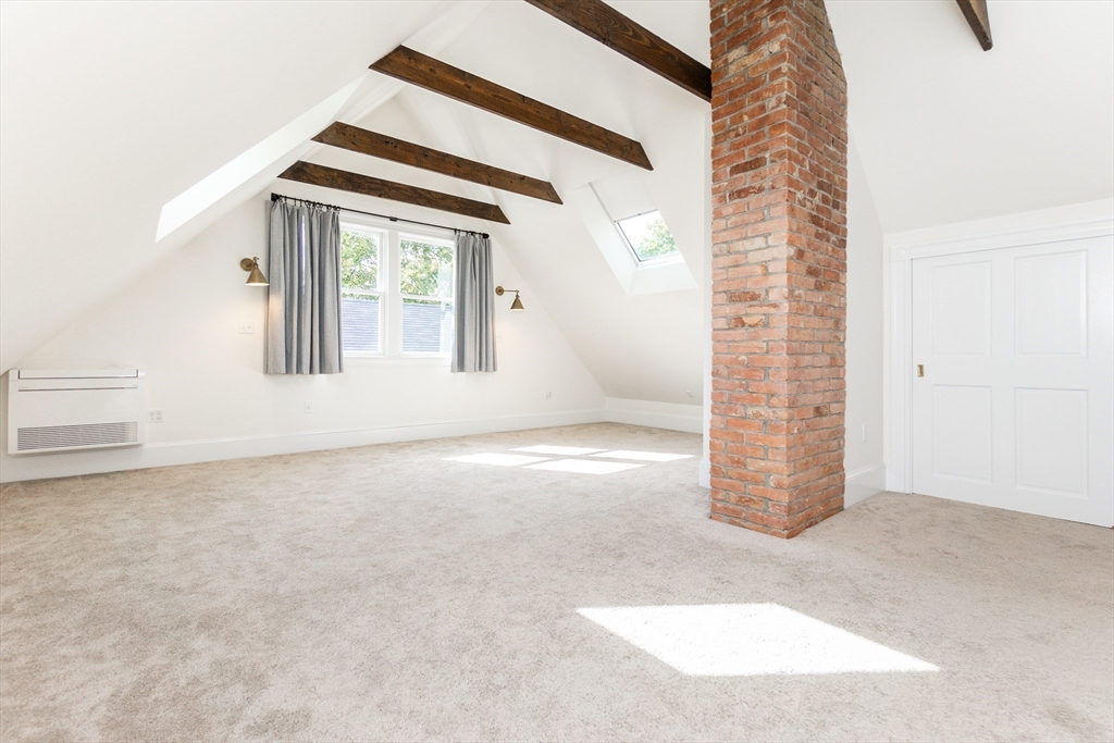 55 Phillips Street, Unit 55 Watertown, MA 02472 - Photo 13 of 15 an empty room with windows