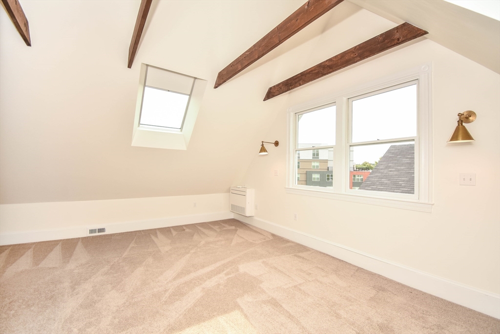 55 Phillips Street, Unit 55 Watertown, MA 02472 - Photo 14 of 15 an empty room with a window