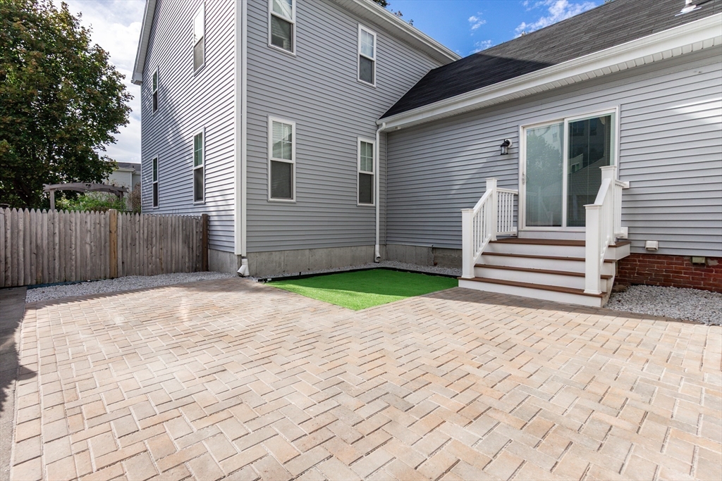 55 Phillips Street, Unit 55 Watertown, MA 02472 - Photo 15 of 15 a view of a backyard of the house