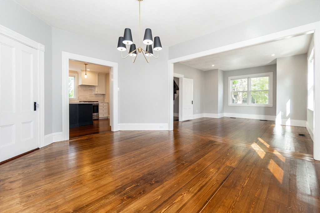 55 Phillips Street, Unit 55 Watertown, MA 02472 - Photo 5 of 15 a view of a room with wooden floor and window
