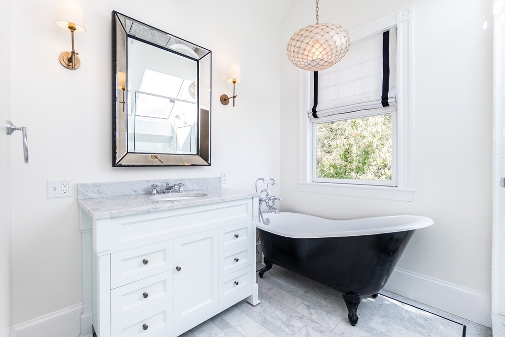 55 Phillips Street, Unit 55 Watertown, MA 02472 - Photo 6 of 15 a bathroom with a sink and a mirror