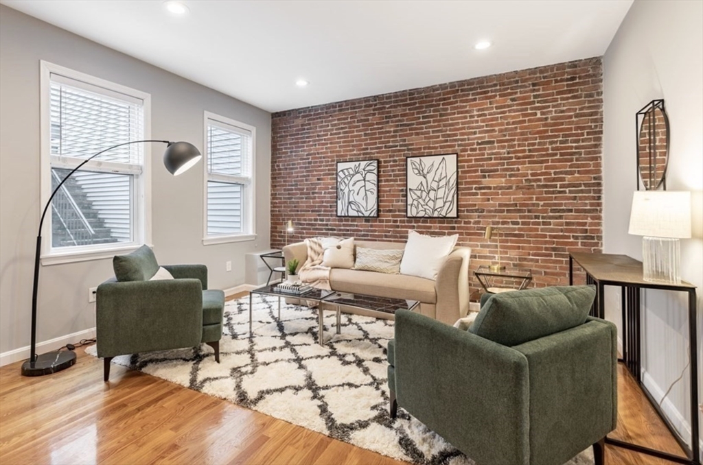 353 Sumner Street, Unit 1 Boston, MA 02128 - Photo 1 of 23 a living room with furniture and a window
