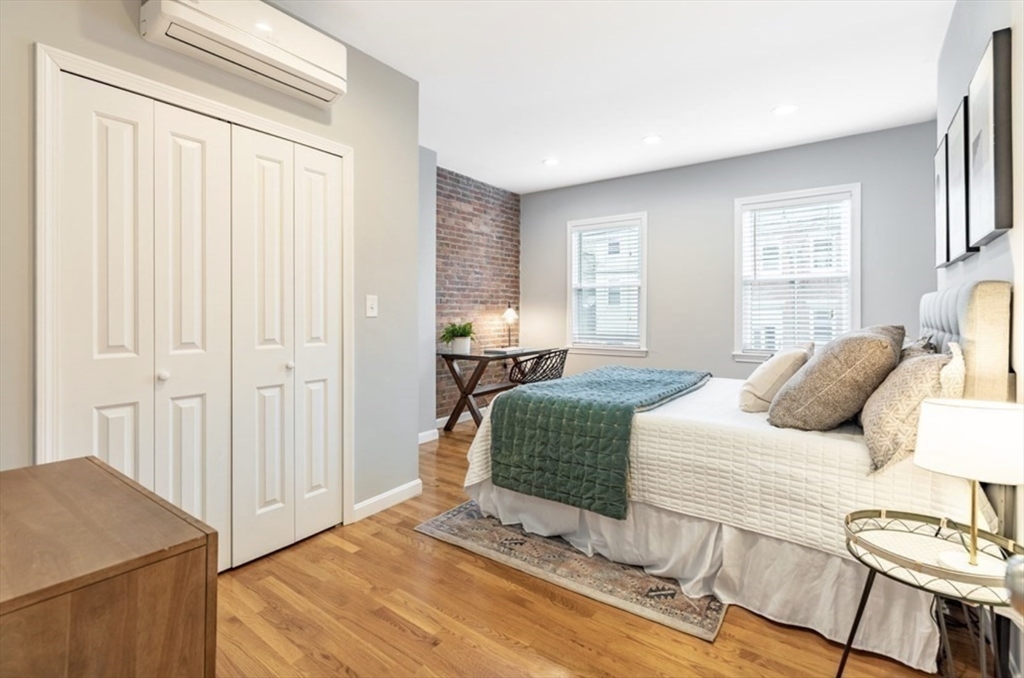 353 Sumner Street, Unit 1 Boston, MA 02128 - Photo 12 of 23 a bedroom with a bed and a window