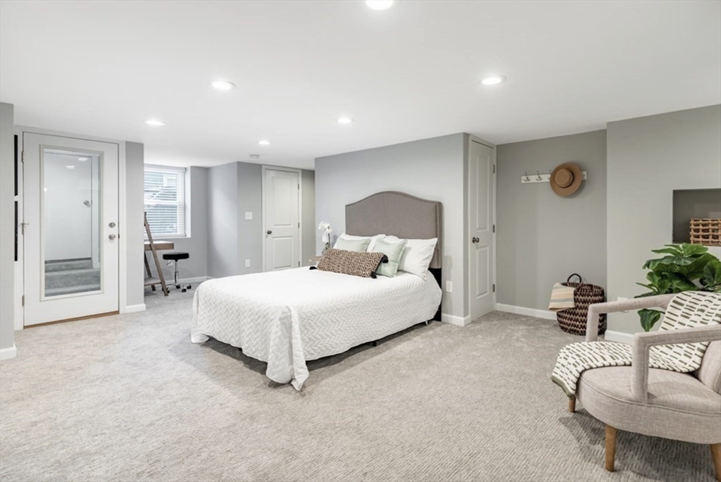 353 Sumner Street, Unit 1 Boston, MA 02128 - Photo 16 of 23 a spacious bedroom with a bed and a couch