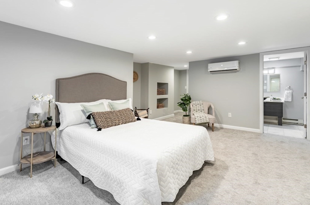 353 Sumner Street, Unit 1 Boston, MA 02128 - Photo 17 of 23 a spacious bedroom with a bed and a cabinets