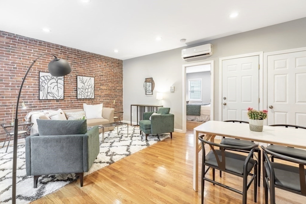 353 Sumner Street, Unit 1 Boston, MA 02128 - Photo 4 of 23 a living room with furniture and a table